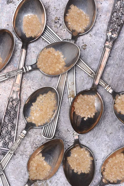 Silver spoonfuls with brown sugar