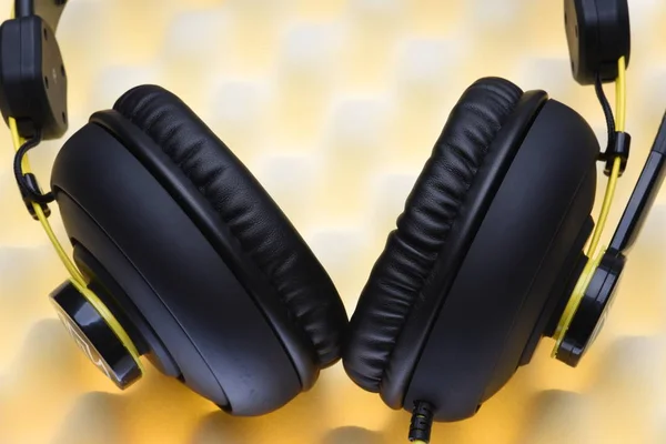 Headphones on acoustic foam — Stock Photo, Image