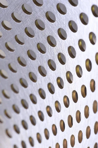 Aluminum metal sheet perforated with holes texture