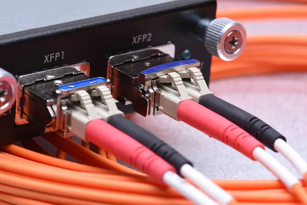 Optical fiber cables connected to gigabit interface converter — Stock Photo, Image