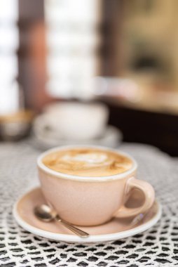 Morning Coffee Cappuccino on Table with Blurred Background
