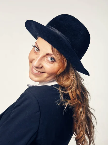 Young attractive woman in a hat — Stock Photo, Image