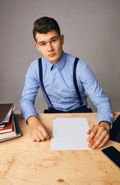 Young man in the workplace thinking about something — Stok fotoğraf