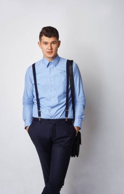 front view portrait of chic posh stylish confident focused concentrated stunning rich wealthy macho keeping hands in pockets sexy look