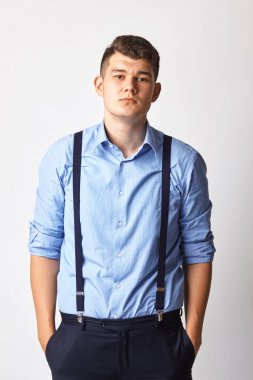 front view portrait of chic posh stylish confident focused concentrated stunning rich wealthy macho keeping hands in pockets sexy look