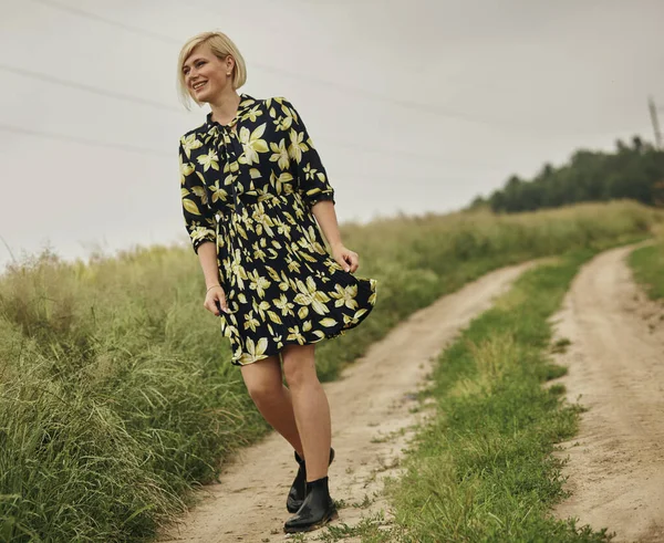 Happy woman relaxing in summer in beautiful field. — Stockfoto