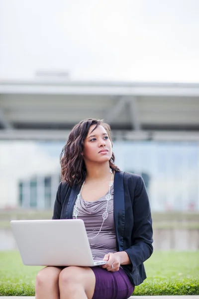 Happy African American businesswoman working on her laptop — Stock Photo, Image