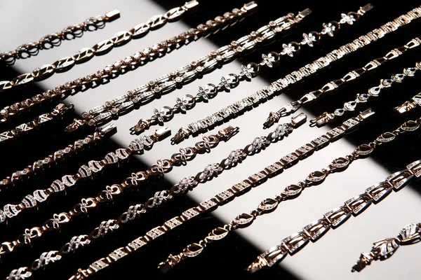 Golden Bracelets On A Glass — Stock Photo, Image