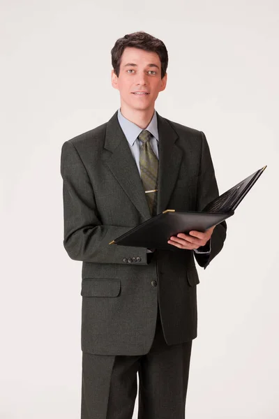Молодой эмоциональный человек в деловом костюме — стоковое фото