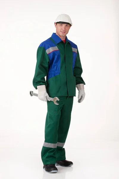 Jongeman Uniform Geïsoleerde Achtergrond Met Een Grote Moersleutel — Stockfoto