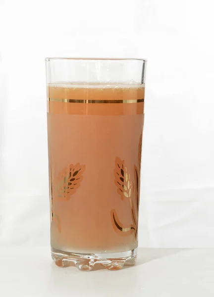 Грейпфрутовий сік у склянці — стокове фото