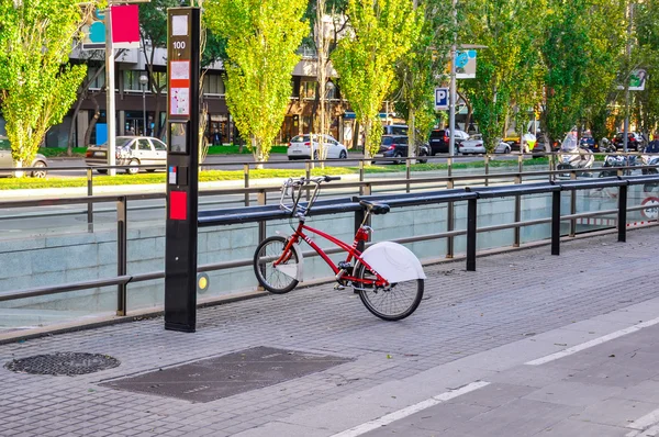 Single bicycle  for rent parked on the street in Barcelona. Εικόνα Αρχείου