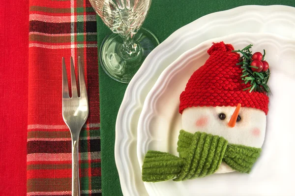 Holiday table setting with snowman and Christmas decorations. — Stock Photo, Image