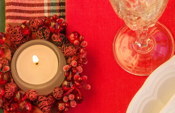 Burning candle on festive table. Christmas theme. — Stock Photo, Image