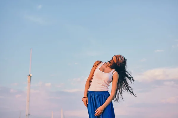 Beautiful girl model posing in a seaport