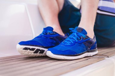 male legs in  blue sneakers clipart