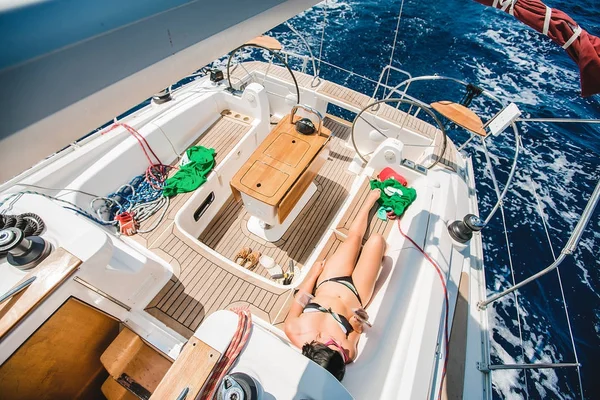 woman  tanning on yacht