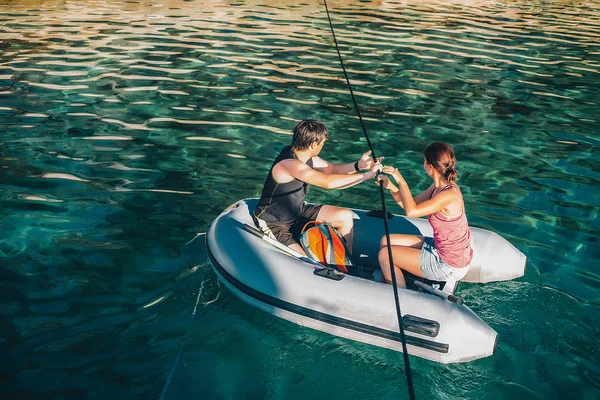 Man  and woman on inflatable boat — Stock Photo, Image