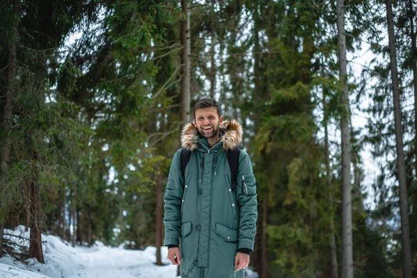 Young Bearded Man Warm Coat Standing Snow Covered Winter Forest — Stockfoto