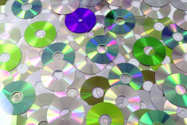 CD and DVD as background — Stock Photo, Image