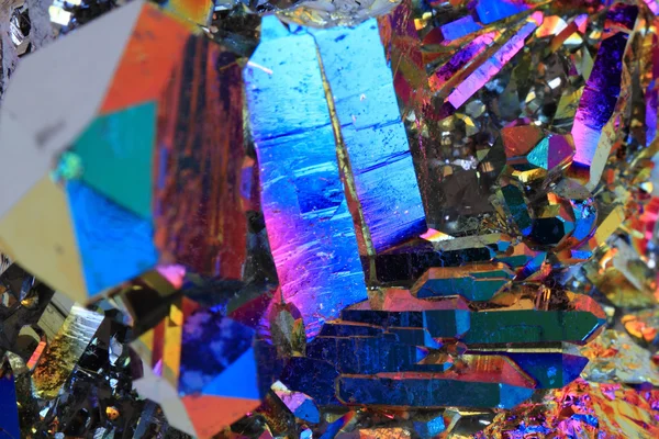 Crystal with metal rainbow surface — Stock Photo, Image