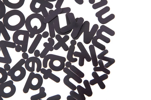 Black plastic alphabet isolated — Stock Photo, Image