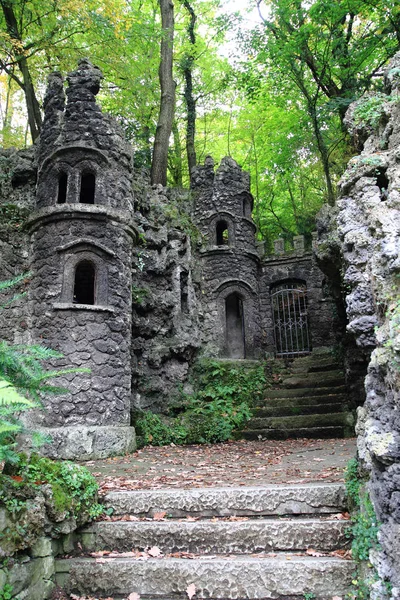 Old dark castle in the green forest — Stock Photo, Image