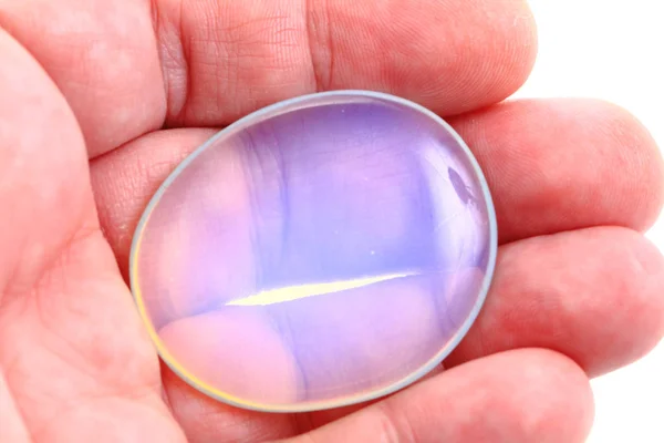 Opalite mineral in human hand — Stock Photo, Image