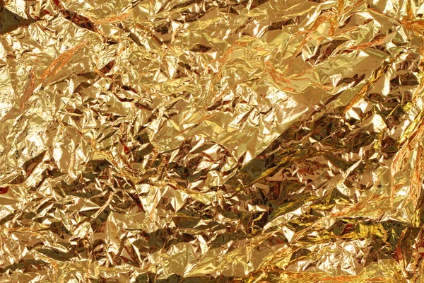 Golden tinfoil texture — Stockfoto