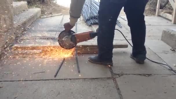 Blacksmith Cutting Iron Bars Outdoor Heavy Construction Work — Stock Video
