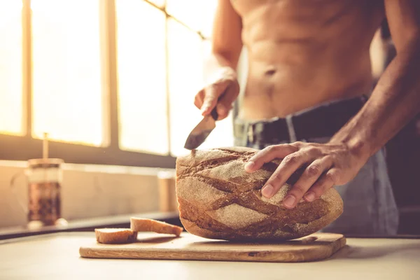 Sexy young man in kitchen — Stock Photo, Image