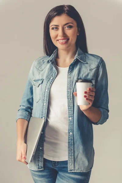 Beautiful young woman with gadget — Stock Photo, Image