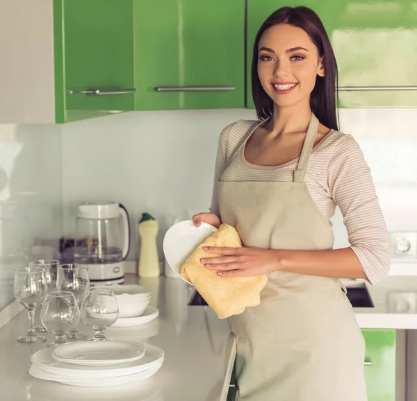 Woman cleaning her kitchen — Stock Photo, Image