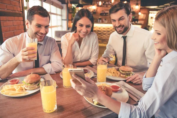 Business team resting in cafe — Stock Photo, Image