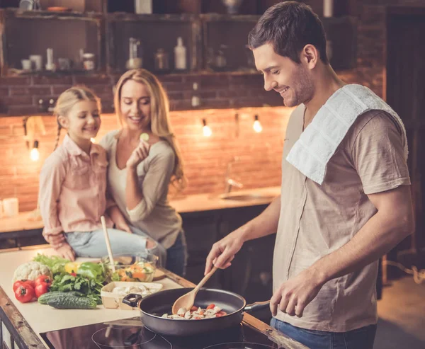 Young family cooking — Stock Photo, Image