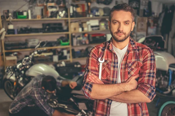 Guys at the motorbike repair shop