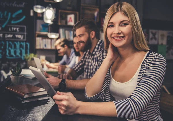 Young people in the library — Stock Photo, Image