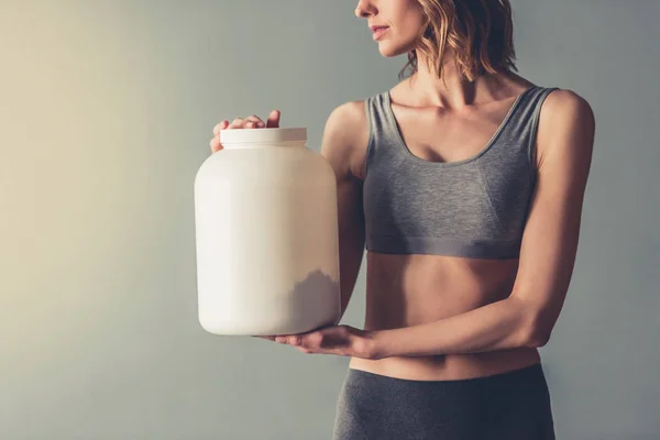 Mulher com nutrição esporte — Fotografia de Stock