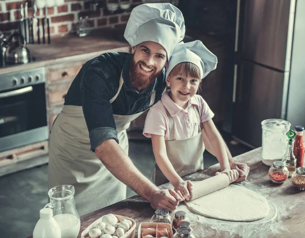 Dad and daughter cooking