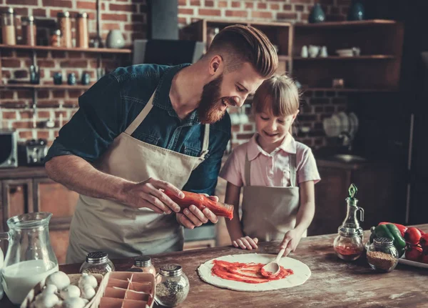 Dad and daughter cooking