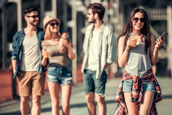 Young people walking outdoors — Stock Photo, Image