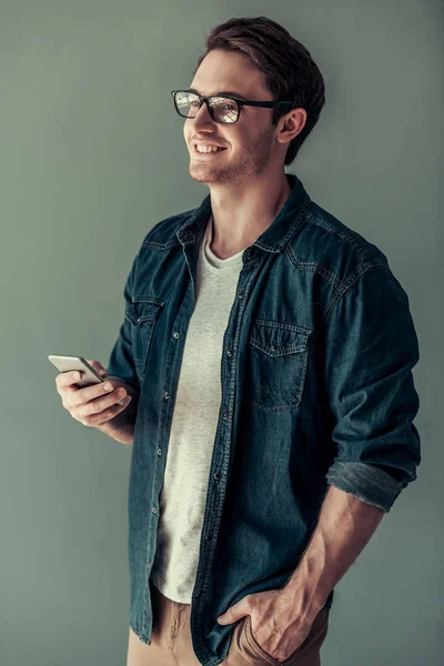 Handsome guy with gadget — Stock Photo, Image