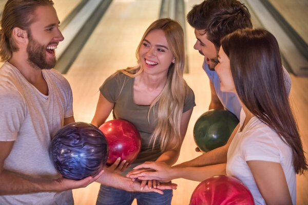 Friends playing bowling 