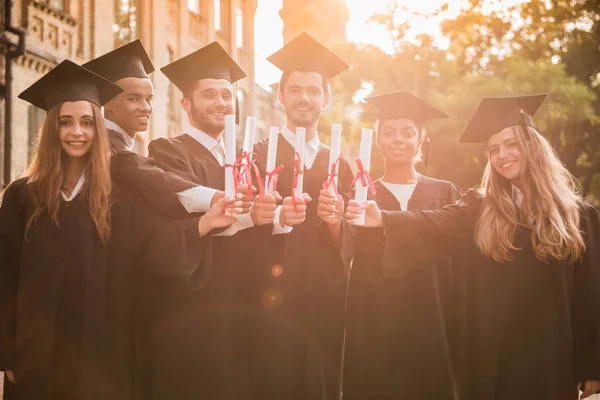 Happy young alumni — Stock Photo, Image