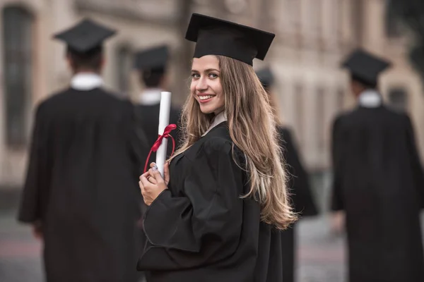 Happy young alumni — Stock Photo, Image