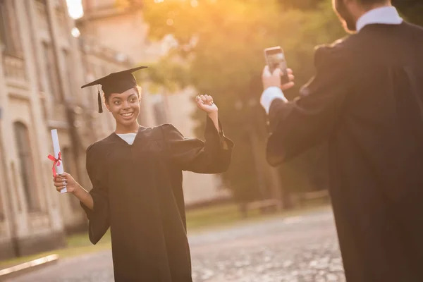 Happy young alumni — Stock Photo, Image