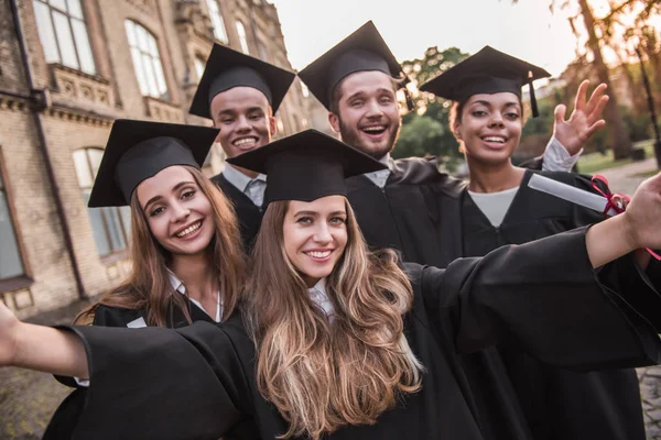 Happy young alumni — Stock Photo, Image