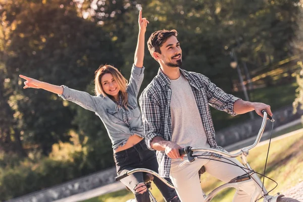 Couple with a tandem bicycle