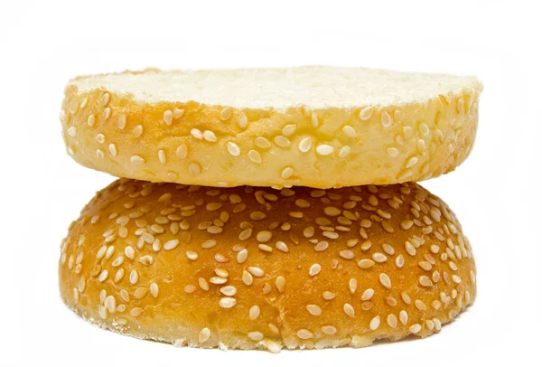 Két felének burger kenyér elszigetelt a fehér — Stock Fotó