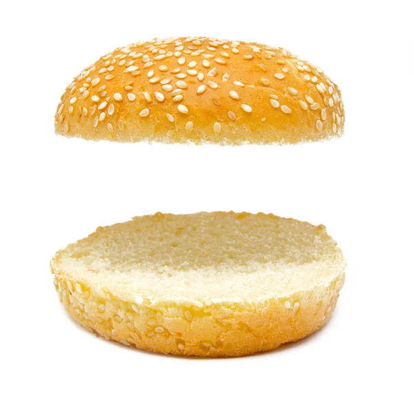 Дві половини бургерного хліба ізольовані на білому Ліцензійні Стокові Фото
